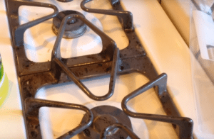 Can cast iron grates be washed in the dishwasher?