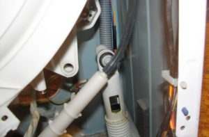 How to change the shock absorber on a Whirlpool washing machine?
