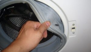 How to change the cuff in a Candy washing machine?