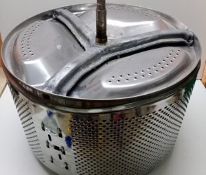 Din ce metal este fabricat tamburul din mașina de spălat?