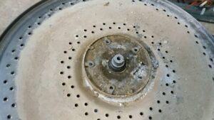Cómo cambiar la brida del tambor de una lavadora de carga superior